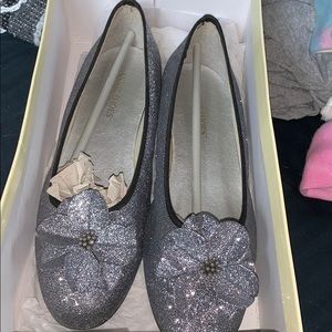 Silver glitter women’s flats with flower accent